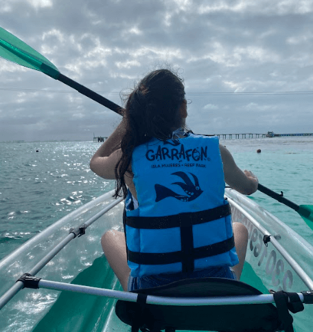 girl kayaking on Isla Mujeres