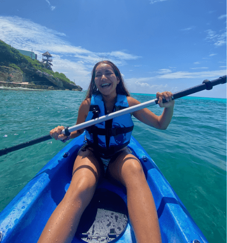 girl kayaking on Isla Mujeres