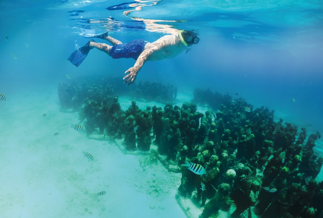 snorkeling in the underwater art museum in cancun isla mujeres